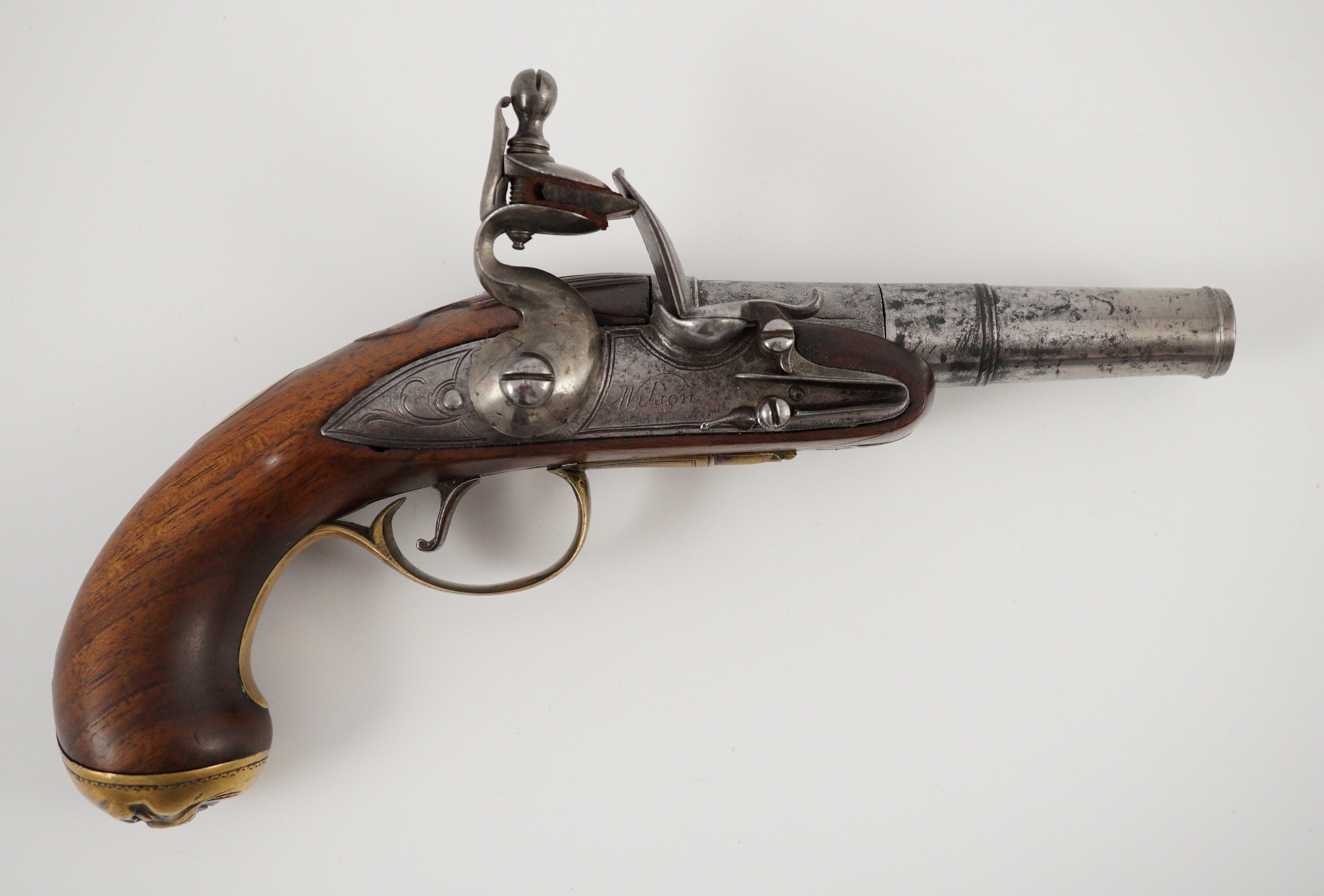 Wilson of London. An early 18th century flintlock pocket pistol, 11cm high 19cm long
